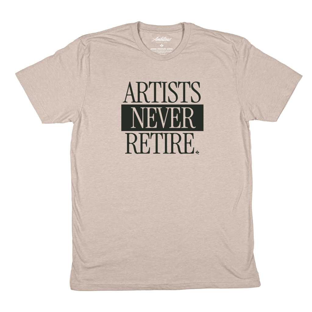 "ARTISTS NEVER RETIRE" Heather Sand T-Shirt