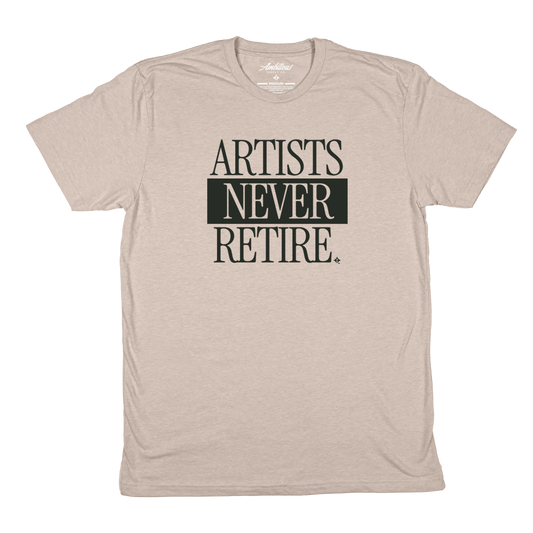 "ARTISTS NEVER RETIRE" Heather Sand T-Shirt